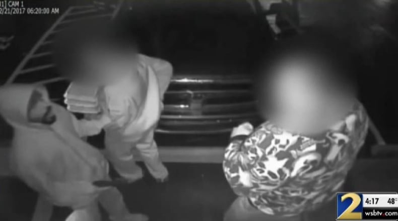Surveillance video shows the man (left), who police say robbed the Rumors gentleman’s club in Forest Park.