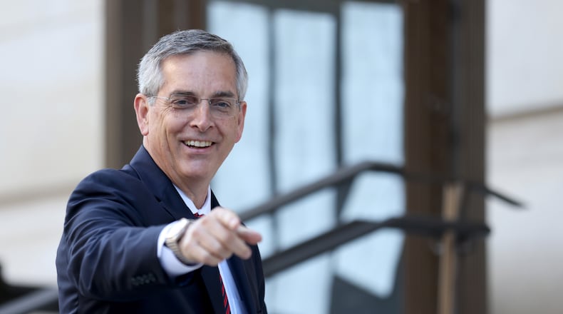 Georgia Secretary of State Brad Raffensperger reacts to members of the media as he enters the Fulton County Courthouse to testify to a grand jury involving the probe into whether former President Donald Trump and others tried to improperly overturn the 2020 election Thursday, June 2, 2022, in Atlanta. (Jason Getz / Jason.Getz@ajc.com)