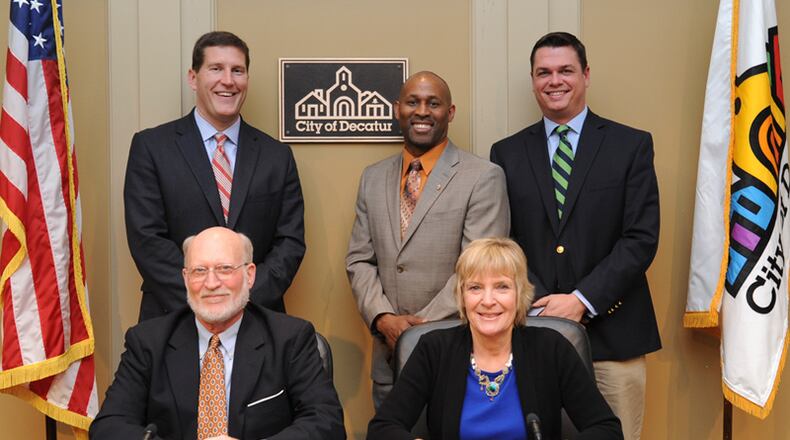 Decatur’s commission recently approved amendments to the alcoholic beverage ordinance allowing for the sale of packaged liquor, beer and wine from the same the retail store. Back row l-r, Brian Smith, Tony Powers and Scott Drake. Front row l-r Fred Boykin and Mayor Patti Garrett. Courtesy City of Decatur.