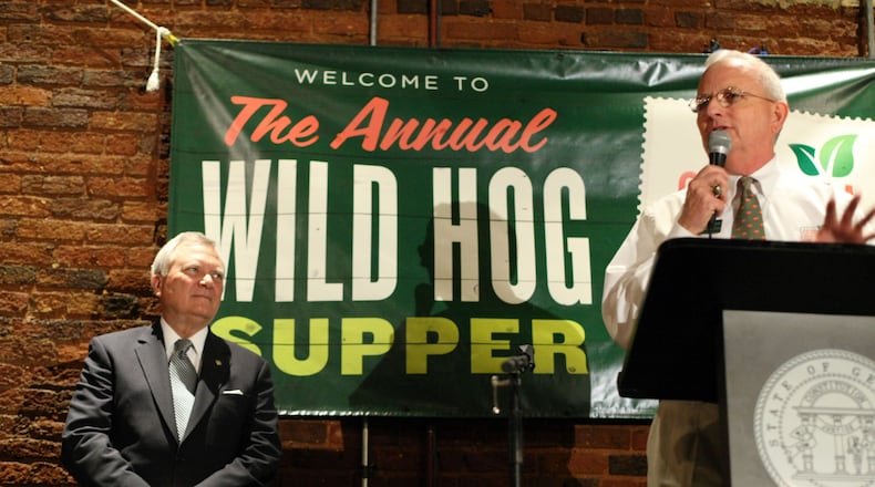 Georgia Gov. Nathan Deal, left, waits to speak as Georgia Agriculture Commissioner Gary Black, introduces him during the 50th annual Wild Hog Supper at the historic Railroad Depot in Atlanta on Jan. 8, 2012.