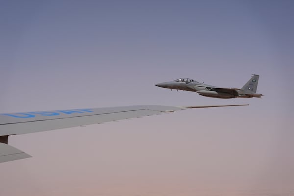 Saudi Air Force F-15 warplanes escort Air Force One carrying President Donald Trump as it arrives in Saudi Arabia, Tuesday, May 13, 2025. (AP Photo/Alex Brandon)