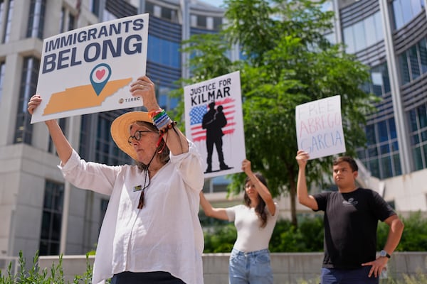 Linda McFadyen-Ketchum, left, holds a protest sign outside the federal courthouse Wednesday, July 16, 2025, in Nashville, Tenn. (AP Photo/George Walker IV)