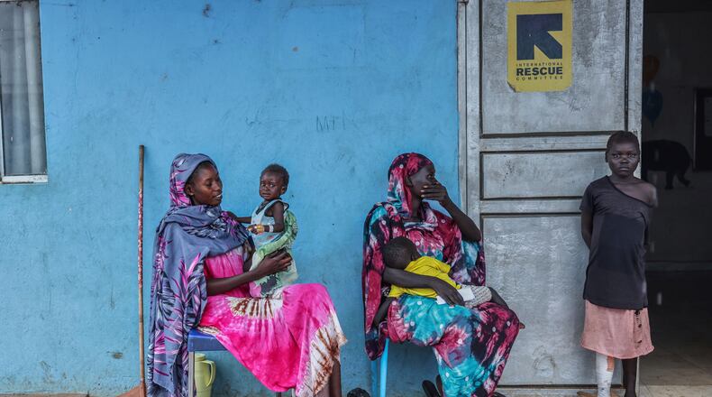 Patients sit outside the malnutrition ward of Bunj Hospital in Maban, South Sudan, Aug. 19, 2025. (AP Photo/Caitlin Kelly, File)