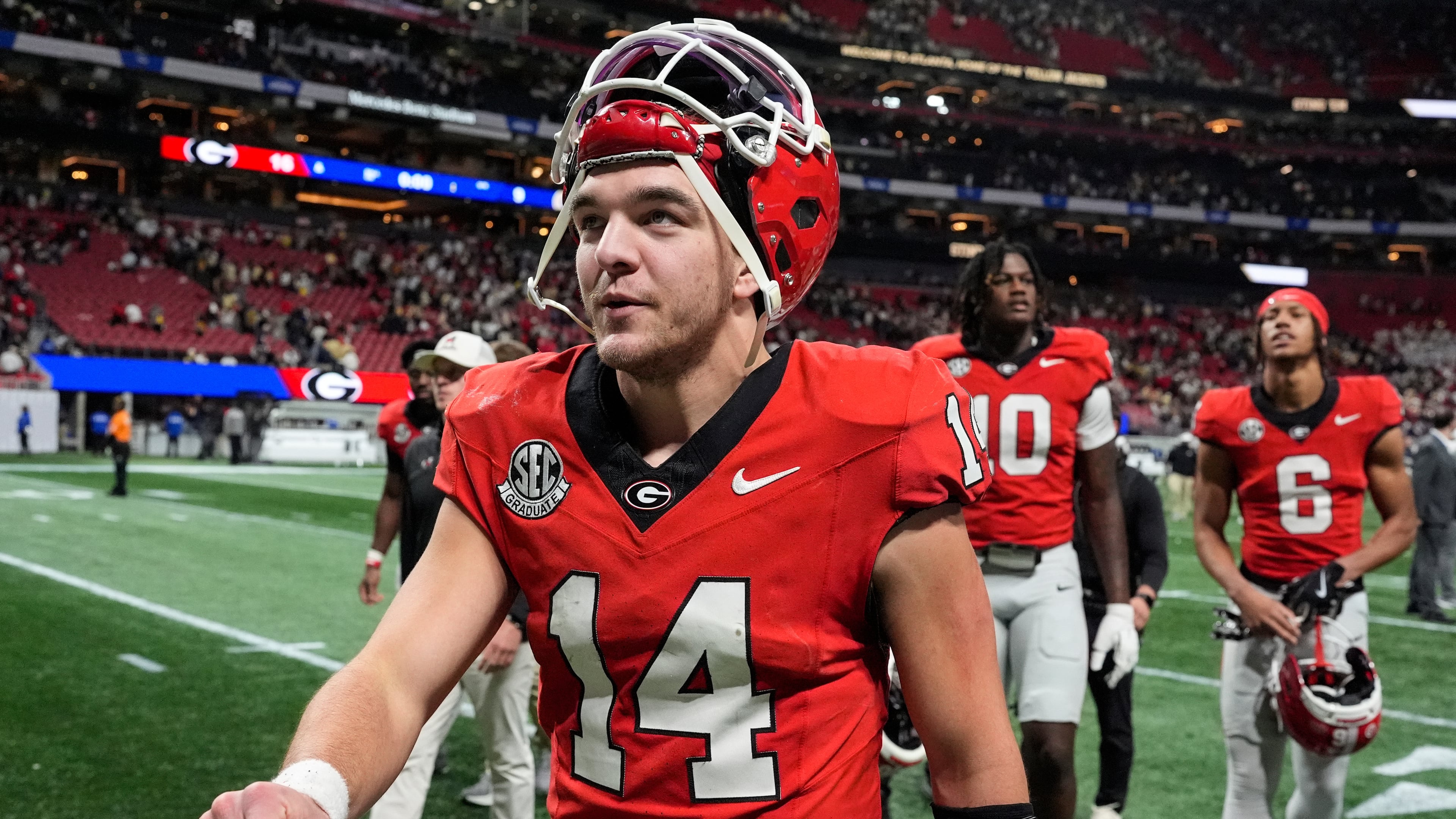 Georgia quarterback Gunner Stockton (14) walks off the field after an NCAA college football game against Georgia Tech, Friday, Nov. 28, 2025, in Atlanta. (AP Photo/Mike Stewart)