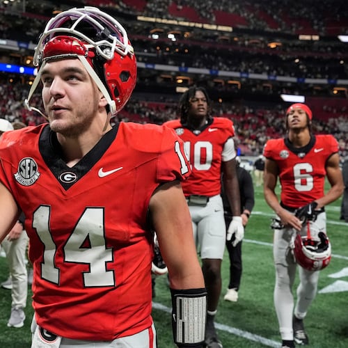Georgia quarterback Gunner Stockton (14) walks off the field after an NCAA college football game against Georgia Tech, Friday, Nov. 28, 2025, in Atlanta. (AP Photo/Mike Stewart)