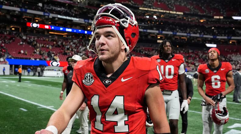 Georgia quarterback Gunner Stockton (14) walks off the field after an NCAA college football game against Georgia Tech, Friday, Nov. 28, 2025, in Atlanta. (AP Photo/Mike Stewart)