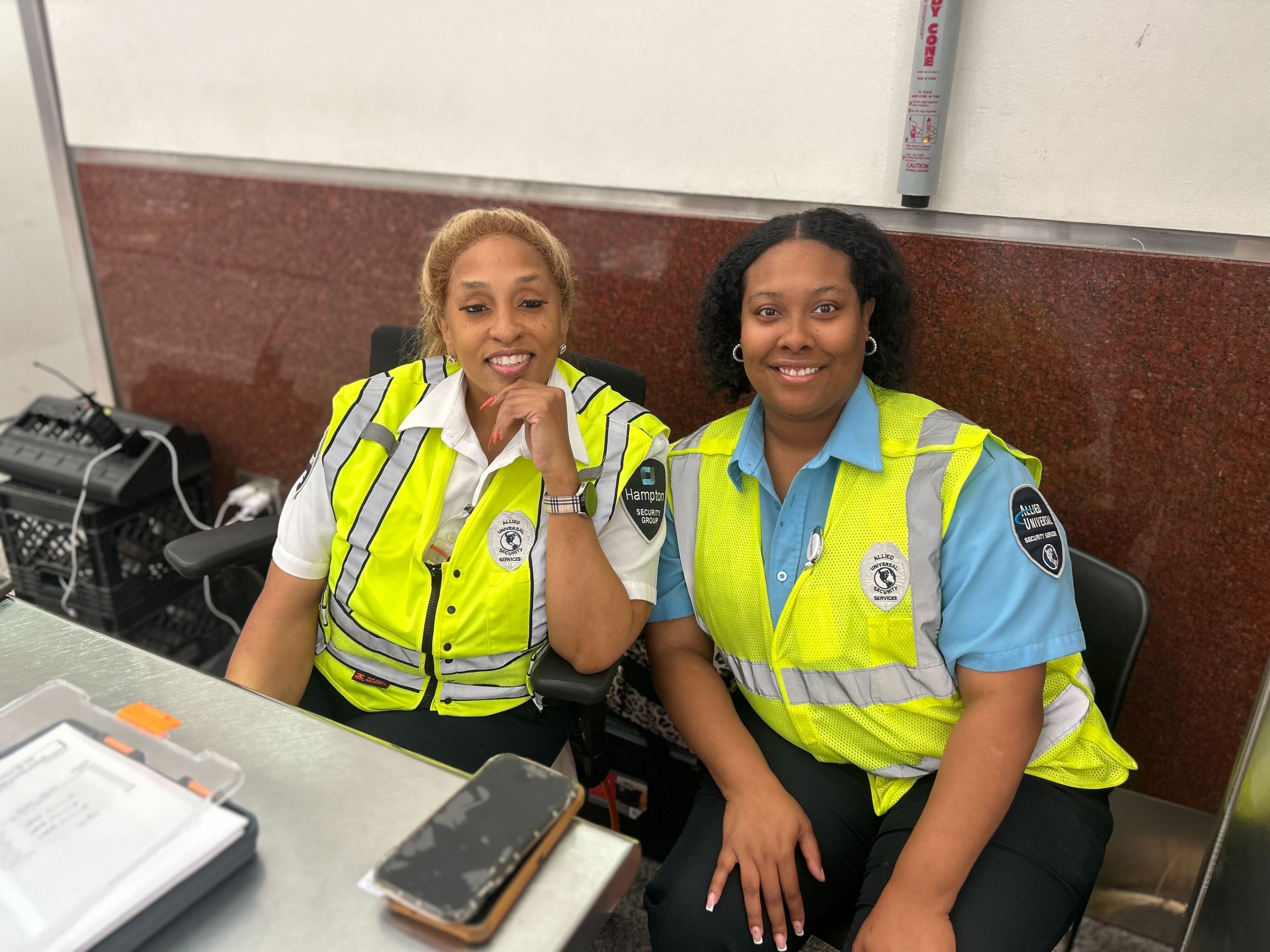 Amanda Watson and Taylor Gholson, two security staff at Hartsfield-Jackson Atlanta International Airport, said the Fourth of July holiday was unusually smooth. (Gray Mollenkamp/AJC)