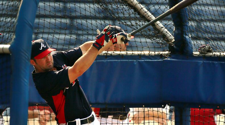 082813 Atlanta: Braves second baseman Dan Uggla is back from the disabled list 15 days after undergoing eye surgery to correct vision problems taking batting practice before the team plays the Cleveland Indians on Wednesday, August 28, 2013, in Atlanta. CURTIS COMPTON / CCOMPTON@AJC.COM