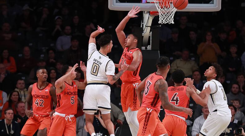Jan. 09, 2019 Atlanta: Georgia Tech guard Michael Devoe gets off a pass under pressure from Virginia Tech defenders during the second half in a NCAA basketball at McCamish Pavilion on Wednesday, Jan. 9, 2019, in Atlanta. Curtis Compton/ccompton@ajc.com
