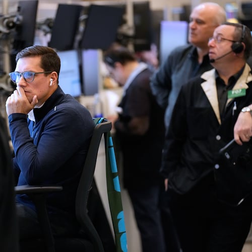 Traders work on the floor at the New York Stock Exchange in New York, Monday, March 2, 2026. (AP Photo/Seth Wenig)
