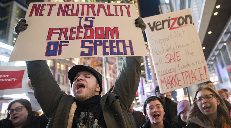 Demonstrators rally in support of net neutrality. AP Photo