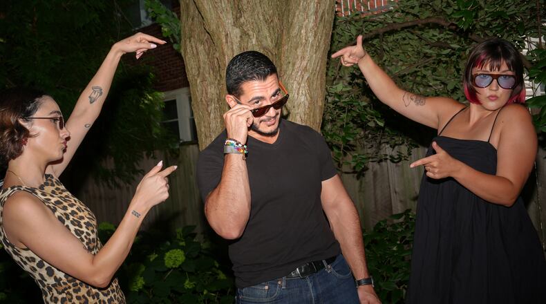 Abdul El-Sayed, a progressive candidate in the Democratic primary for U.S. Senate in Michigan, films a social media video at a pool party for content creators supporting his campaign, Monday, Aug. 3, 2026, in Detroit. (AP Photo/Julia Demaree Nikhinson)