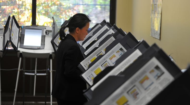 November 2, 2012: While hundreds wait in line just outside empty voting machines surround a Sandy Spring voter Friday November 2, 2012. The delay has been during the sign-in process, not from the lack of voting booths available. BRANT SANDERLIN / BSANDERLIN@AJC.COM