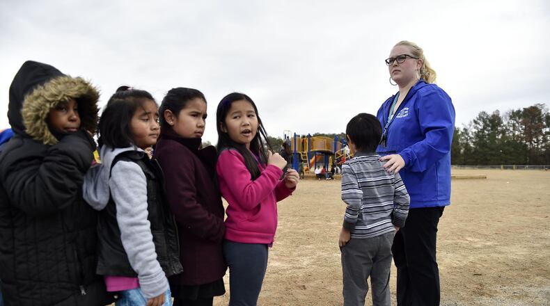 December 14, 2016, Norcross - Audrey Smith, 25, a first grade teacher at Baldwin Elementary School, brings her class back inside after recess in Norcross, Georgia, on Wednesday, December 14, 2016. Despite never having taught her own class before this year, Smith leads like a veteran teacher. (DAVID BARNES / DAVID.BARNES@AJC.COM)