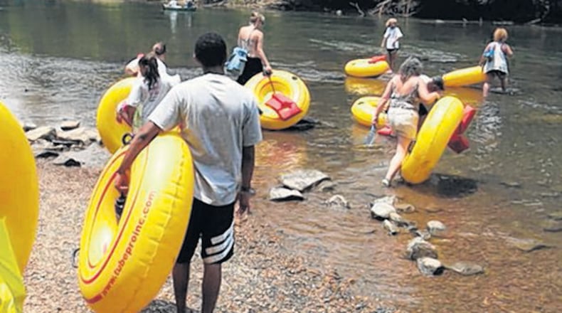 The family was rescued from their location on the river between Medlock and East Jones bridges.