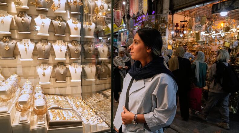 A woman looks at jewelry in the window of a gold shop at Tehran's historic Grand Bazaar, Iran, Sunday, May 3, 2026. (AP Photo/Vahid Salemi)