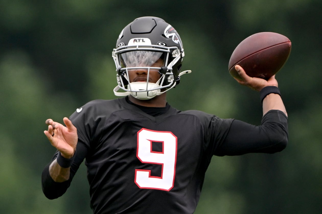 Falcons quarterback Michael Penix Jr. runs a drill during an OTA workout at the team's traning facility on Wednesday, May 27, 2026, in Flowery Branch. (Hyosub Shin/AJC)