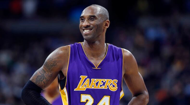 FILE - In this Dec. 30, 2014, file photo, Los Angeles Lakers guard Kobe Bryant stands on the court during a review in the fourth quarter of an NBA basketball game against the Denver Nuggets in Denver. Phil Jackson doubts this is Kobe Bryant's final season _ though thinks it may be Bryant's last in Los Angeles. (AP Photo/David Zalubowski)