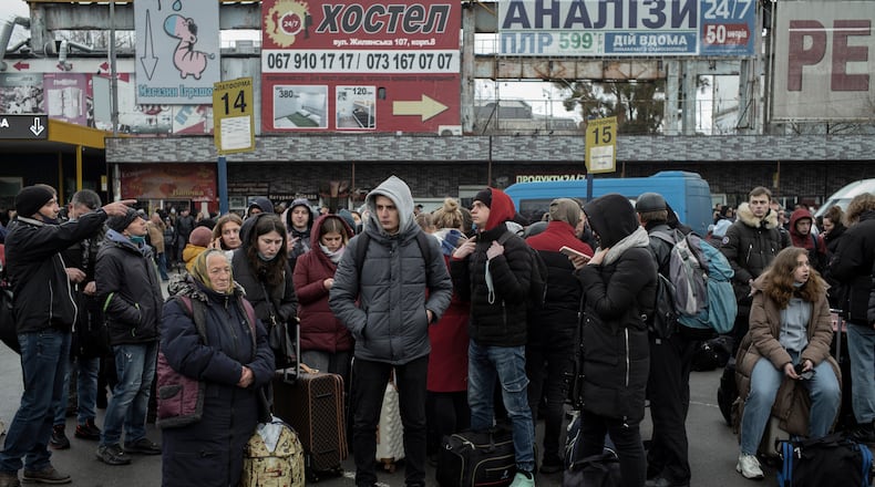 People line up at a long distance bus station in the center of Kyiv, Ukraine, on Thursday, Feb. 24, 2022. A mass migration appears underway as residents flee the capital. (Emile Ducke/The New York Times)