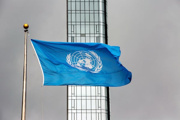 FILE - The United Nations flag flies on a stormy day at the U.N. during the United Nations General Assembly, Sept. 22, 2022. (AP Photo/Ted Shaffrey, File)