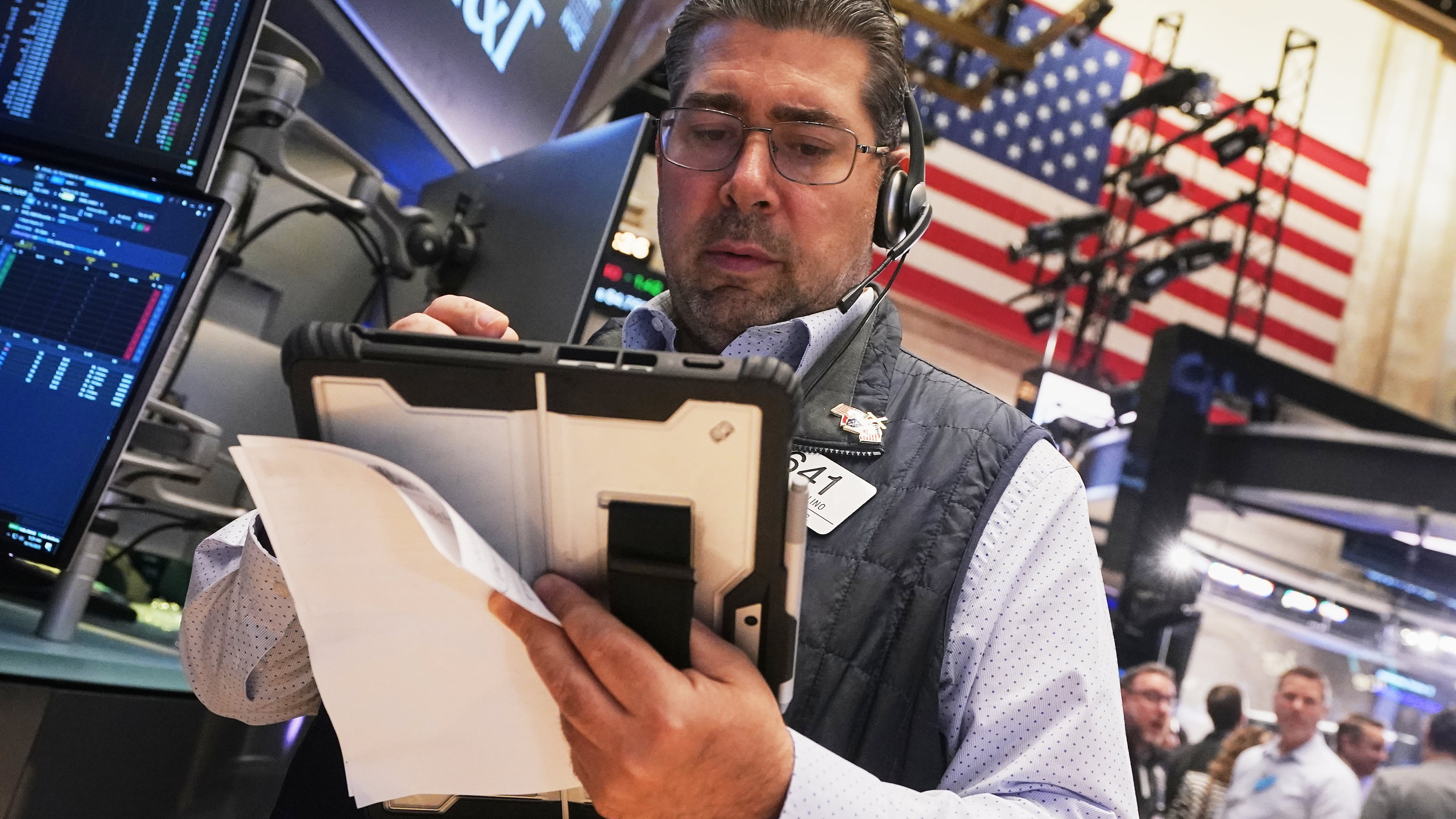 Trader Michael Capolino works on the floor of the New York Stock Exchange, Wednesday, Oct. 15, 2025. (AP Photo/Richard Drew)