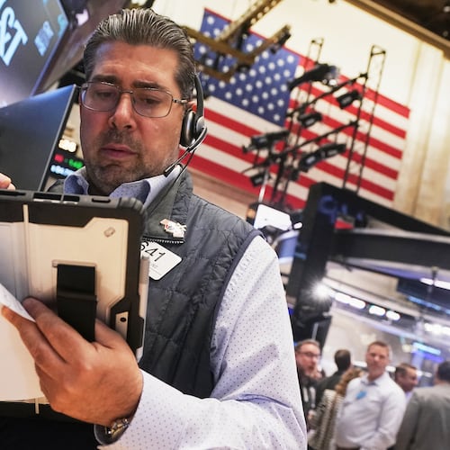 Trader Michael Capolino works on the floor of the New York Stock Exchange, Wednesday, Oct. 15, 2025. (AP Photo/Richard Drew)