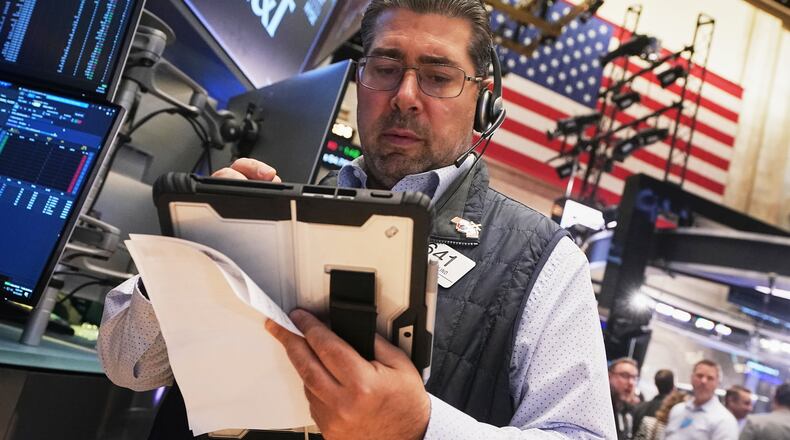 Trader Michael Capolino works on the floor of the New York Stock Exchange, Wednesday, Oct. 15, 2025. (AP Photo/Richard Drew)
