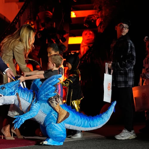 President Donald Trump and first lady Melania Trump participate in a Halloween at the White House event on the South Lawn, Thursday, Oct. 30, 2025, in Washington. (AP Photo/Alex Brandon)