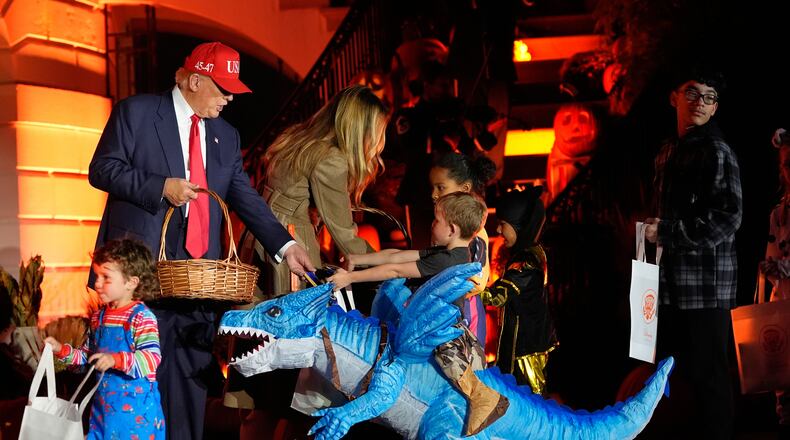 President Donald Trump and first lady Melania Trump participate in a Halloween at the White House event on the South Lawn, Thursday, Oct. 30, 2025, in Washington. (AP Photo/Alex Brandon)