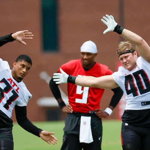 Atlanta Falcons linebacker JD Bertrand, right, and safety Xavier Watts stretch during minicamp at the Atlanta Falcons Training Facility, Wednesday, June 11, 2025, in Flowery Branch. Bertrand is expected to get more playing time with Divine Deablo out. (Miguel Martinez/AJC)