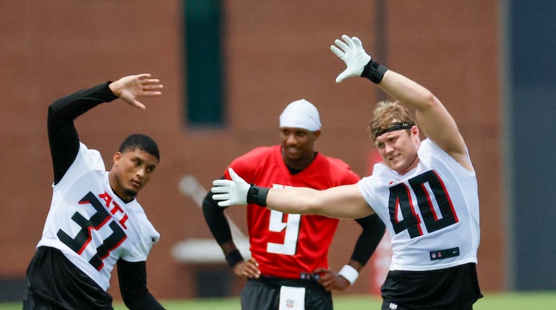 Atlanta Falcons linebacker JD Bertrand (40) and Atlanta Falcons safety Xavier Watts (31) stretch during minicamp at the Atlanta Falcons Training Facility, Wednesday, June 11, 2025, in Flowery Branch, Ga.
(Miguel Martinez/AJC)