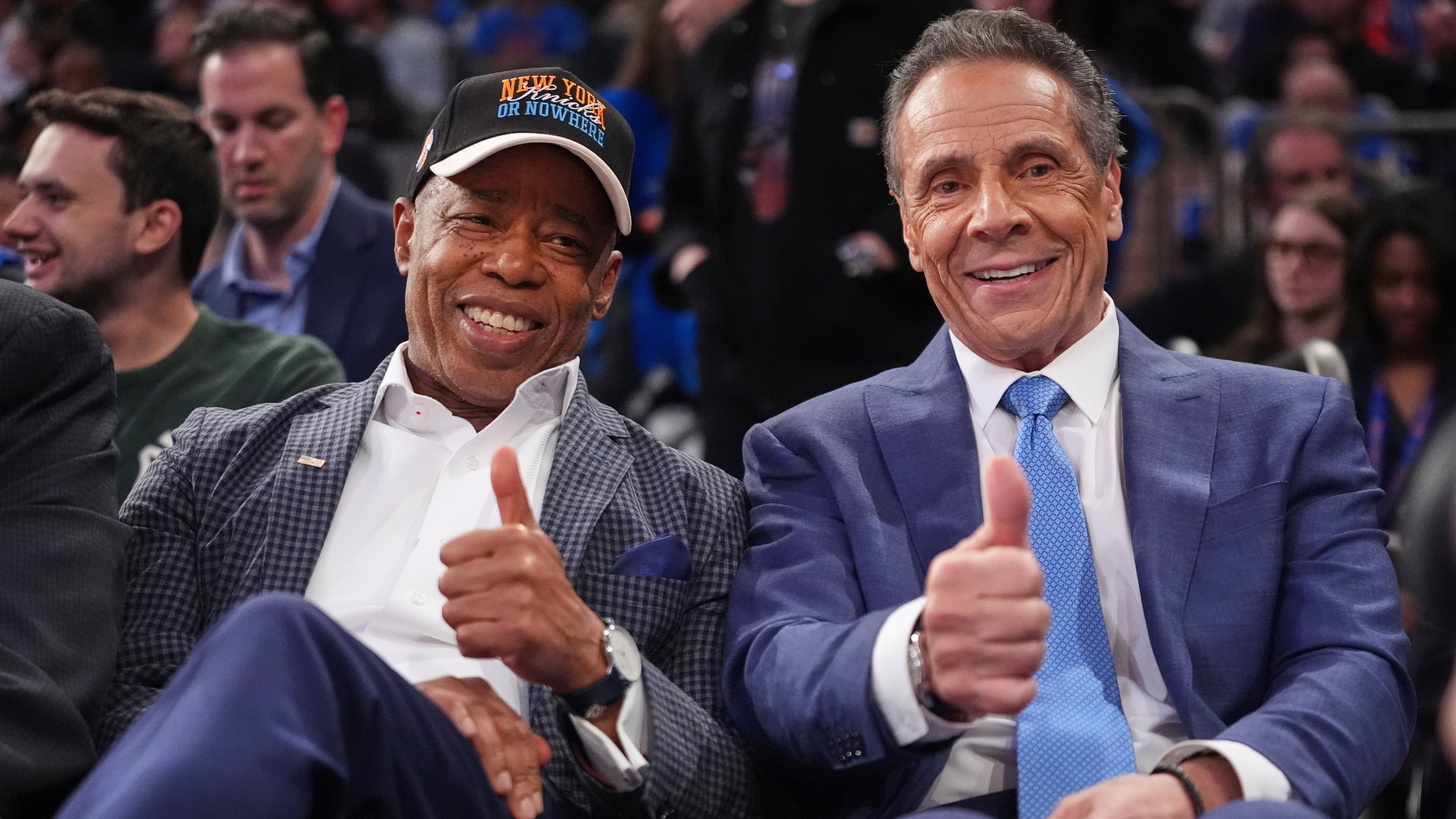 New York City Mayor Eric Adams, left, and Independent candidate former New York Gov. Andrew Cuomo, right, pose during the second half of an NBA basketball game between the New York Knicks and the Cleveland Cavaliers Wednesday, Oct. 22, 2025, at Madison Square Garden in New York. (AP Photo/Frank Franklin II)