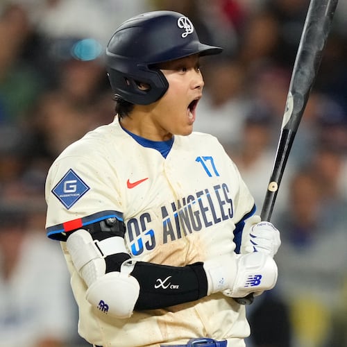 Los Angeles Dodgers' Shohei Ohtani reacts after a pitch was thrown in the dirt during the seventh inning of a baseball game against the Philadelphia Phillies, Saturday, May 30, 2026, in Los Angeles. (AP Photo/Mark J. Terrill)