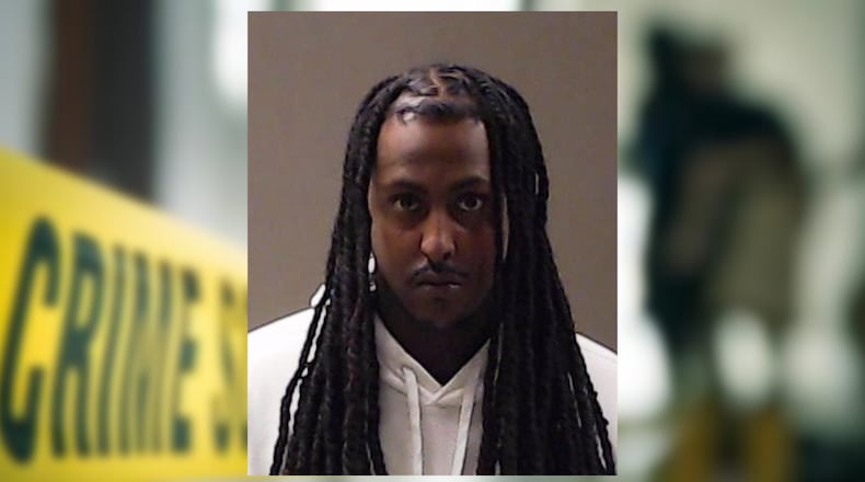 Daniel Menisteab is charged with murder in the Aug. 28 shooting outside a DeKalb County eatery, police said.
