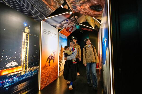 People visit Algeria's pavilion during the Expo 2025 in Osaka, western Japan, Tuesday, April 15, 2025. (AP Photo/Hiro Komae)