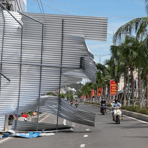 A damaged building blocks a road in Dak Lak, Vietnam on Friday, Nov. 7, 2025 after Typhoon Kalmaegi lashed Vietnam with fierce winds and torrential rains. (AP Photo/Hau Dinh)
