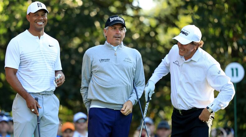 Tiger Woods, Fred Couples and Phil Mickelson of the United States talk on the 11th hole during a practice round prior to the start of the 2018 Masters Tournament at Augusta National Golf Club on April 3, 2018 in Augusta, Georgia. (Photo by Andrew Redington/Getty Images)