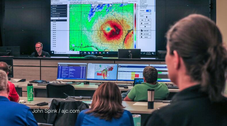 The GEMA operation center prepares ahead of Hurricane Michael's anticipated landfall on Wednesday.