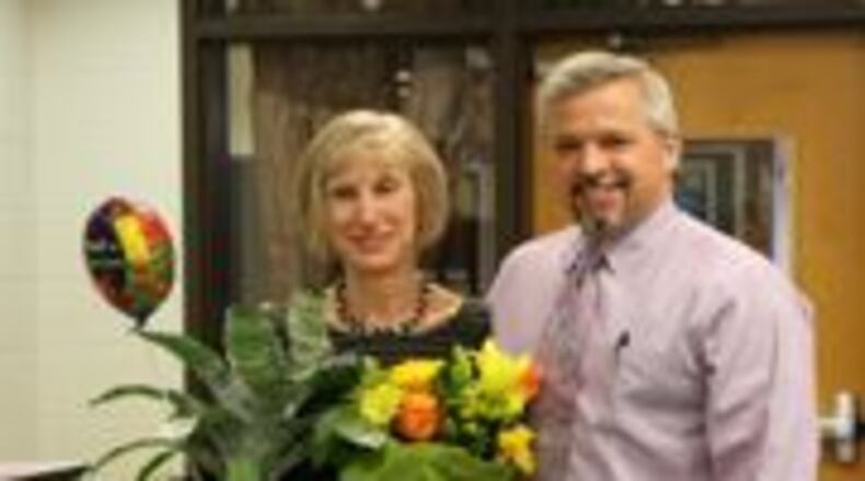 Couch MS Principal Devon Williams congratulates Karen Garner on her selection as GCPS Media Specialist of the Year.