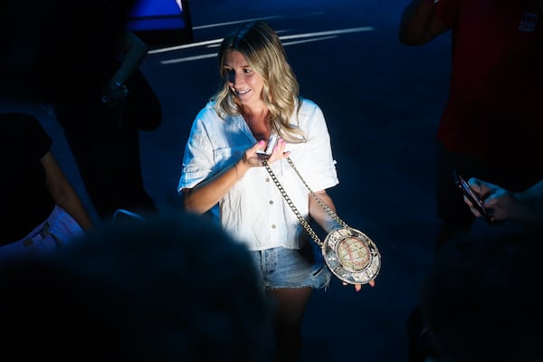 A representative from Major League Baseball shows off the Home Run Derby Chain during a media tour of the All-Star Village at the Cobb Galleria.