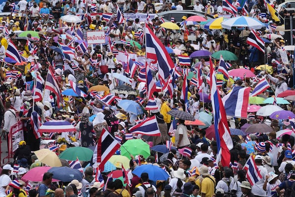 Protesters gather at Victory Monument demanding Thailand's Prime Minister Paetongtarn Shinawatra resign in Bangkok, Thailand, Saturday, June 28, 2025. (AP Photo/Sakchai Lalit)