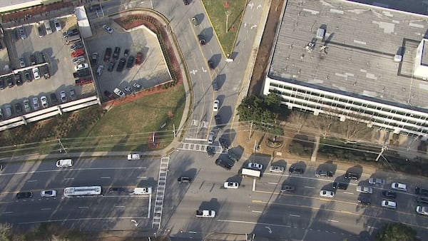Dozens line up to get the COVID-19 vaccine at the Atlanta VA Medical Center. On Monday, the state will open eligibility to more than half of Georgia's adults.
