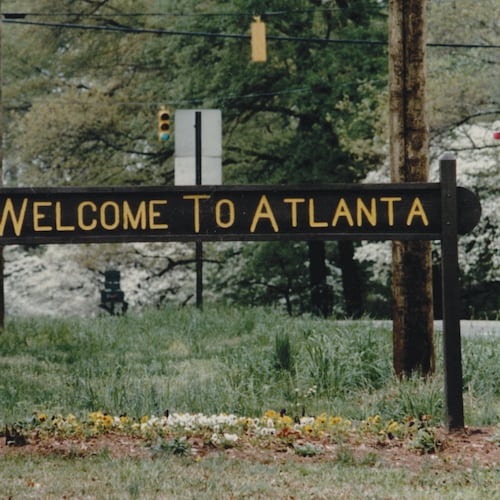 A rustic sign on Ponce de Leon Avenue at the city's edge read “Welcome to Atlanta” on one side and “Leaving Atlanta” on the other side. The sign stood at the edge of the Olmsted Linear Park next to a city-limits marker and might have been updated over the years. (Kimberly Smith/AJC Archive at GSU Library 1993)