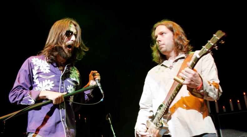 Vocalist Chris Robinson, left, and guitarist Rich Robinson of The Black Crowes perform with the band as the opening act for Tom Petty and the Heartbreakers at the Tweeter Center in Mansfield, Mass., on Saturday, June 18, 2005. (AP Photo/Robert E. Klein) Chris and Rich Robinson in more harmonious times in 2005. Photo: AP