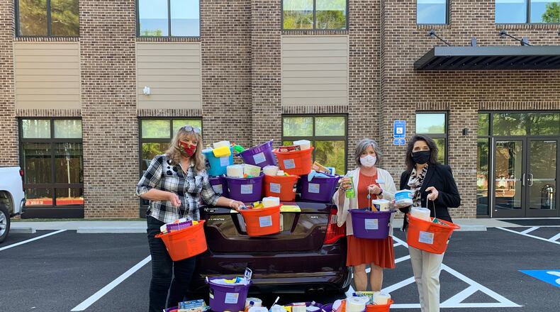 This year, North Fulton Community Charities (NFCC) celebrated 50 years of easing the hardships of those facing housing and food insecurity for the North Fulton community with a fall festival at one of its two Roswell locations. NFCC partners with many local groups, including the Rotary Club of Roswell. Courtesy of North Fulton Community Charities