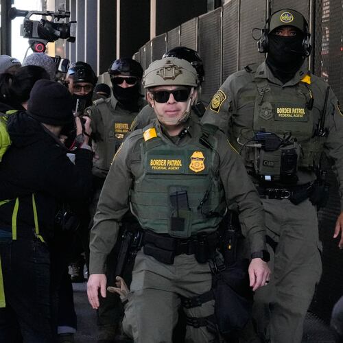 FILE - U.S. Customs and Border Patrol agents arrive to escort U.S. Customs and Border Patrol Gregory Bovino from federal court in Chicago, Oct. 28, 2025. (AP Photo/Nam Y. Huh, File)