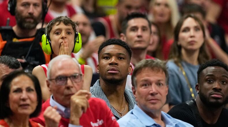 Giannis Antetokounmpo of the Milwaukee Bucks, center, looks on during the Euroleague final basketball match between Olympiacos and Real Madrid in Athens, Greece, Sunday, May 24, 2026. (AP Photo/Thanassis Stavrakis)