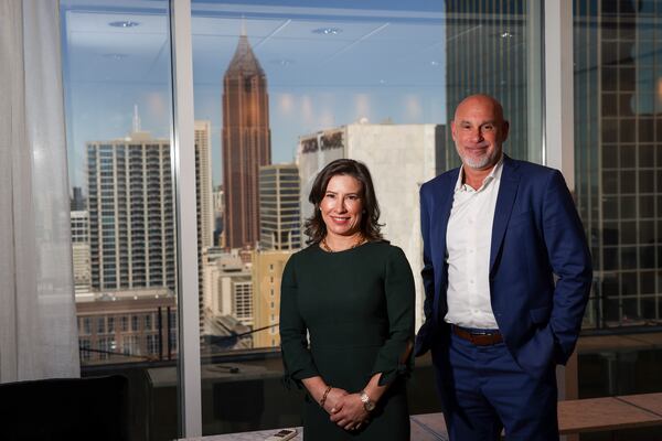 Blackstone Sr. Managing Director Andrea Drasites (left) and Andmore CEO Jon Pertchik pose for a photograph in Pertchik’s office at AmericasMart on Thursday in Atlanta. Jason Getz/AJC

