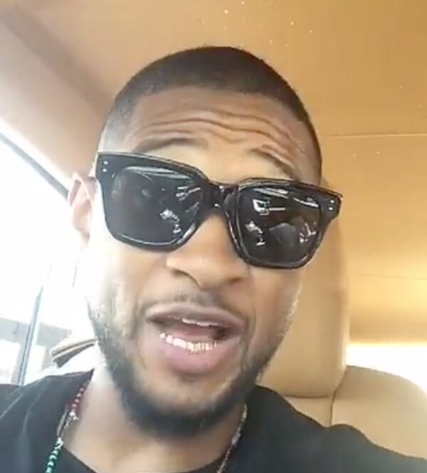 An image from Usher's old-school car karaoke session.