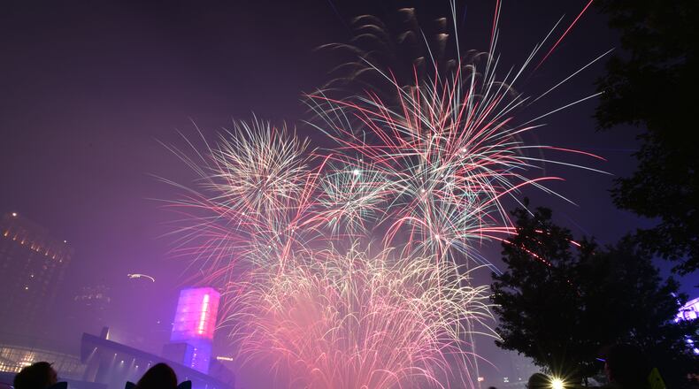 July 4, 2017 Atlanta - The finale fireworks spectacular light up over the Downtown skyline during Centennial Olympic Park's Fourth of July Celebration on Tuesday, July 4, 2017. Centennial Olympic Parkâs annual Fourth of July Celebration offers free family-oriented entertainment, including live music and the Southeastâs largest fireworks display. Georgia World Congress Center Authority, which owns and operates the 21-acre park, has partnered with Lenox Square to combine both facilitiesâ popular fireworks shows. HYOSUB SHIN / HSHIN@AJC.COM